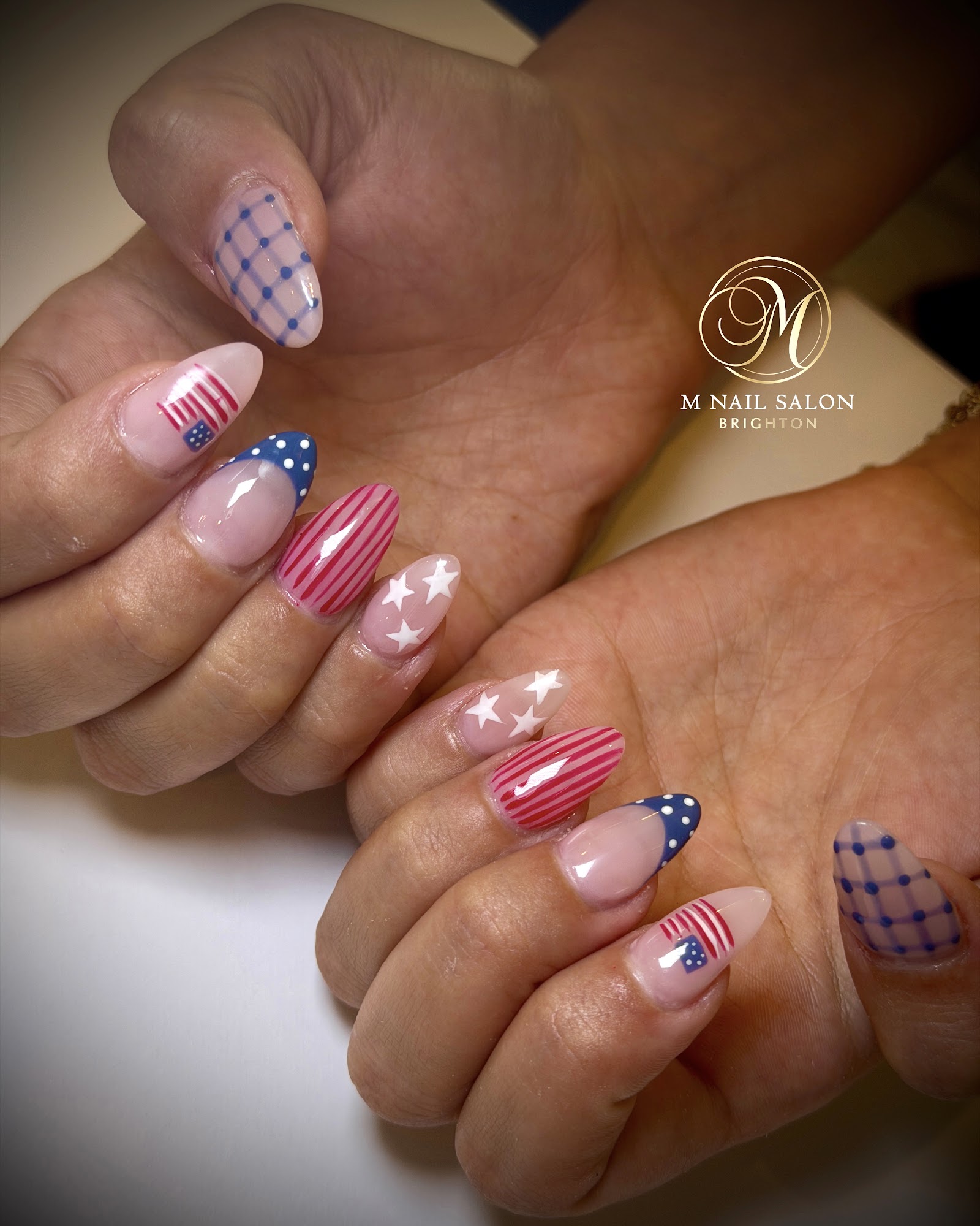 M NAIL SALON logo